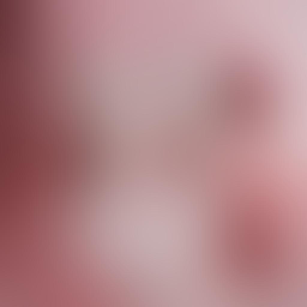 An elegant display of lingerie in various styles and colors, showcasing romantic lace pieces alongside playful and flirty designs. The background features soft lighting with a hint of roses and satin fabric accents, creating a mood of intimacy and allure. Include a subtle gradient transitioning from warm pinks to passionate reds, emphasizing emotions. super-realistic. vibrant colors. soft focus.